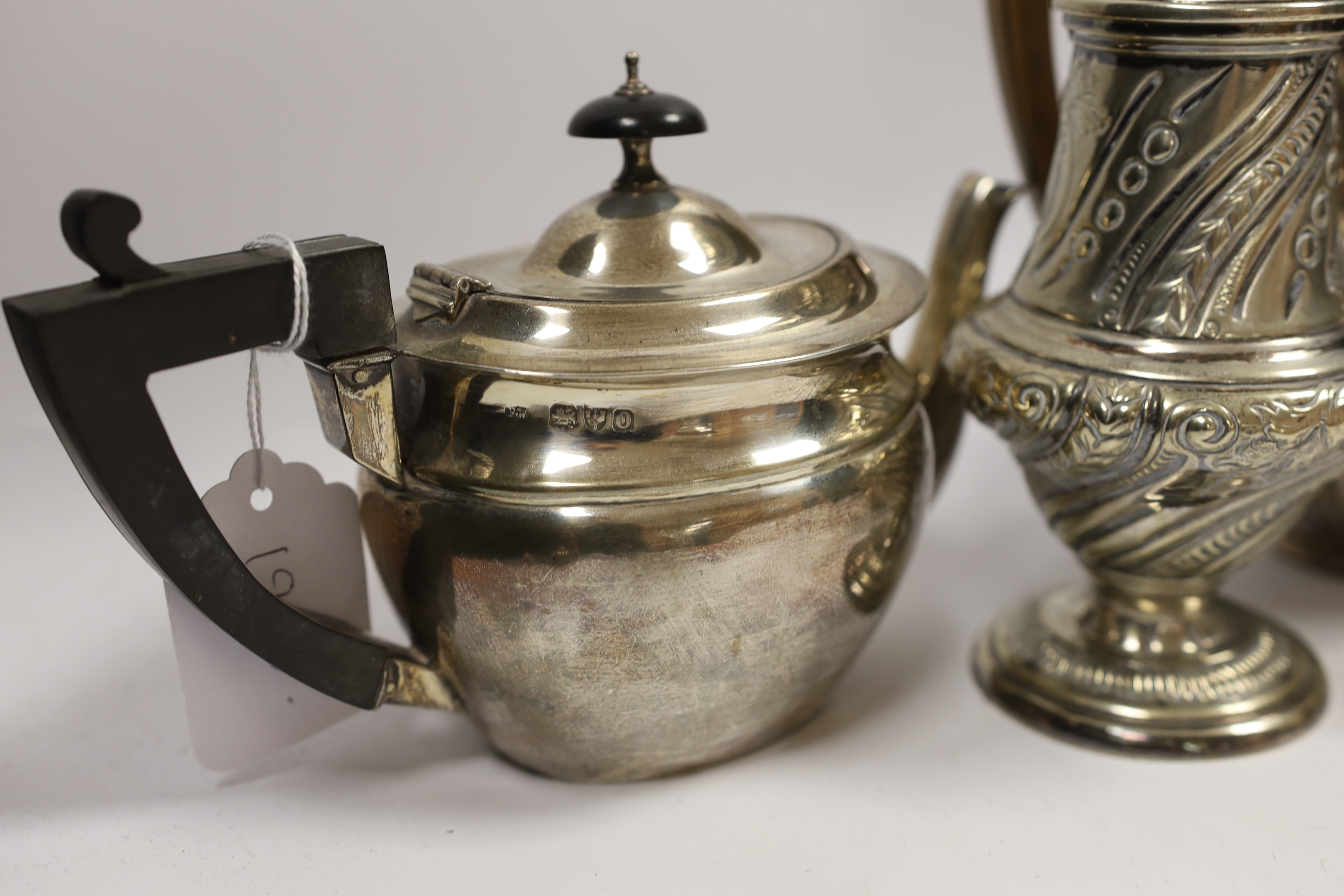 A late Victorian silver bachelor's oval teapot, Florence Warden, Chester, 1897, together with a small Edwardian silver sauceboat and four items of plated ware including a sugar caster and teapot